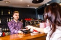 paying by credit card at cafe concept Customer paying for order with a smart phone contactless payment Royalty Free Stock Photo