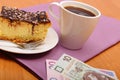 Paying for cheesecake and coffee in cafe using polisg currency money Royalty Free Stock Photo