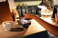 Paying With Mobile Phone In Cafe Royalty Free Stock Photo