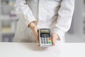 Paying with payment terminal in pharmacy Royalty Free Stock Photo