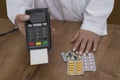 Paying with payment terminal in pharmacy. Royalty Free Stock Photo