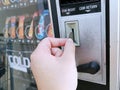 Paying with a quarter coin in a vending machine