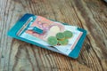 Payment on the bill in a cafe on a plate on a wooden table Royalty Free Stock Photo