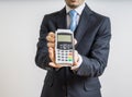 Payment with credit card. Businessman holds payment terminal in hand Royalty Free Stock Photo