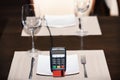 Payment with credit card. Credit card terminal on plate