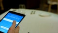 Payment by cryptocurrency in the restaurant using a tablet close up. Stock. Man sitting in internet caffe and going to Royalty Free Stock Photo