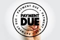 Payment Due text inside a circular stamp with a hand writing behind it, representing billing alerts, invoice reminders, Royalty Free Stock Photo