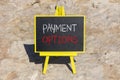 Payment options symbol. Concept words Payment options on beautiful black blackboard. Beautiful stone beach background. Business