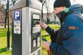 Payment for parking in the City of Gdansk, Poland on February 8, 2020. A person uses monobank credit card for nfc payment in Royalty Free Stock Photo