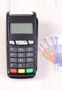 Payment terminal, credit card reader with currencies euro, cashless paying for shopping or products Royalty Free Stock Photo