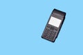 Payment terminal isolated on a dlue background. Contactless payment Royalty Free Stock Photo