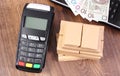Payment terminal with polish money, laptop and boxes on pallet, paying for shipping and products Royalty Free Stock Photo