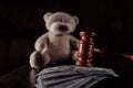 Payments Alimony. Wooden Judge Gavel, Money Banknotes And Teddy Bear As A Symbol Children`s Protection. Divorce And