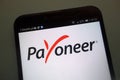 Payoneer logo on a smartphone