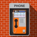 Payphone on brick wall. Royalty Free Stock Photo