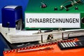 Payroll Lohnabrechnungen - an inscription on a folder in German. Accounting cash document of large enterprises for payment of
