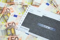 Payroll slip on pile of 50 EUR banknotes Royalty Free Stock Photo