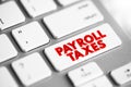 Payroll Taxes are the taxes employees and employers pay on wages, tips and salaries, text concept button on keyboard Royalty Free Stock Photo