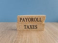 Payroll taxes symbol. Concept words