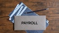 Payroll word written on envelope. Business and financial concept Royalty Free Stock Photo