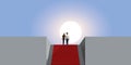 A couple goes up a staircase with a red carpet.