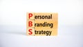 PBS, Personal branding strategy symbol. Concept words PBS, Personal branding strategy on wooden blocks on a beautiful white