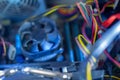 PC components in dust. Dusty power wires, CPU fan soft focus