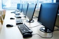 Pc computer workspaces in a row for creative workers, programmer or students in a computer lab Royalty Free Stock Photo