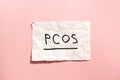 PCOS - Polycystic ovary syndrome, woman sickness lettering on pink background