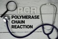 PCR Polymerase Chain Reaction text with Stethoscope on wooden background Royalty Free Stock Photo