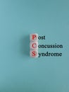 PCS post-concussion syndrome symbol. Concept red words PCS post-concussion syndrome on wooden cubes