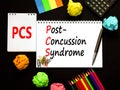 PCS post-concussion syndrome symbol. Concept words PCS post-concussion syndrome on white note on a beautiful black background.