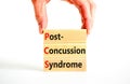 PCS post-concussion syndrome symbol. Concept words PCS post-concussion syndrome on wooden blocks on a beautiful white table white