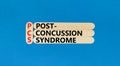 PCS post-concussion syndrome symbol. Concept words PCS post-concussion syndrome on wooden stick on a beautiful blue table blue