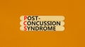 PCS post-concussion syndrome symbol. Concept words PCS post-concussion syndrome on wooden stick on a beautiful orange table orange