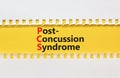 PCS post-concussion syndrome symbol. Concept words PCS post-concussion syndrome on yellow paper on a beautiful white paper