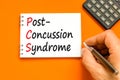 PCS post-concussion syndrome symbol. Concept words PCS post-concussion syndrome on white note on a beautiful orange background.
