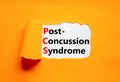 PCS post-concussion syndrome symbol. Concept words PCS post-concussion syndrome on white paper on a beautiful orange background.