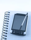 Pda on notepad Royalty Free Stock Photo