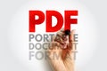 PDF PORTABLE DOCUMENT FORMAT written in large bold letters with a hand marker, concept of electronic file sharing, reading, and Royalty Free Stock Photo