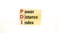 PDI power distance index symbol. Concept words PDI power distance index on wooden blocks on a beautiful white background. Business Royalty Free Stock Photo