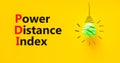 PDI power distance index symbol. Concept words PDI power distance index on yellow paper on a beautiful yellow background. Green Royalty Free Stock Photo