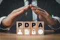 Pdpa compliance data protection act concept with hands protecting blocks personal data privacy security Royalty Free Stock Photo