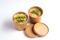 Pea and chicken soup in paper disposable cups for take-out or delivery of food on white background