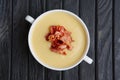 Pea cream soup with bacon chips Royalty Free Stock Photo