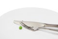 Pea cutlery on plate Royalty Free Stock Photo