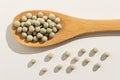 Pea. Healthy grains on a wooden spoon. White background. Royalty Free Stock Photo