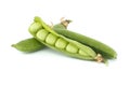 Pea pod is open and green peas inside over white background Royalty Free Stock Photo