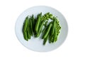 Pea pods and peas in a plate Royalty Free Stock Photo