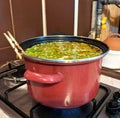 Pea soup, boiled in a brown pot Royalty Free Stock Photo